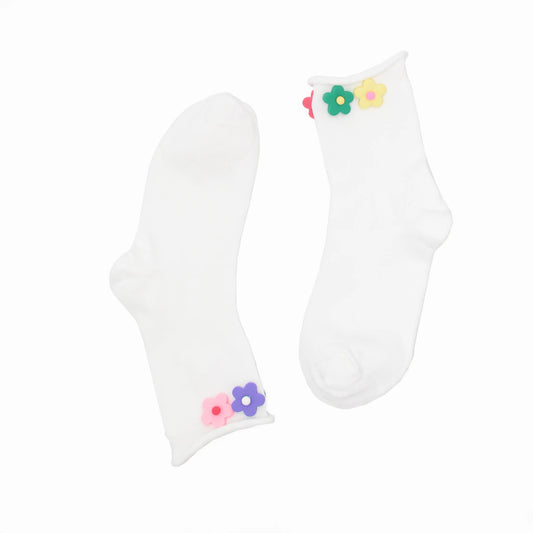 White socks with colorful flower designs on a white background