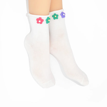 White socks with colorful flower designs on a white background