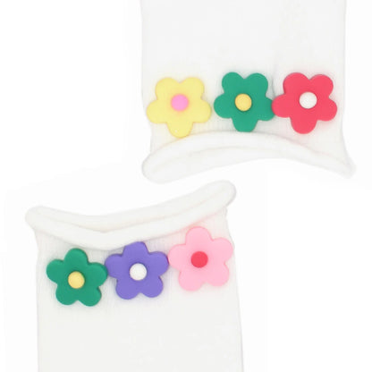 White socks with colorful flower designs on a white background