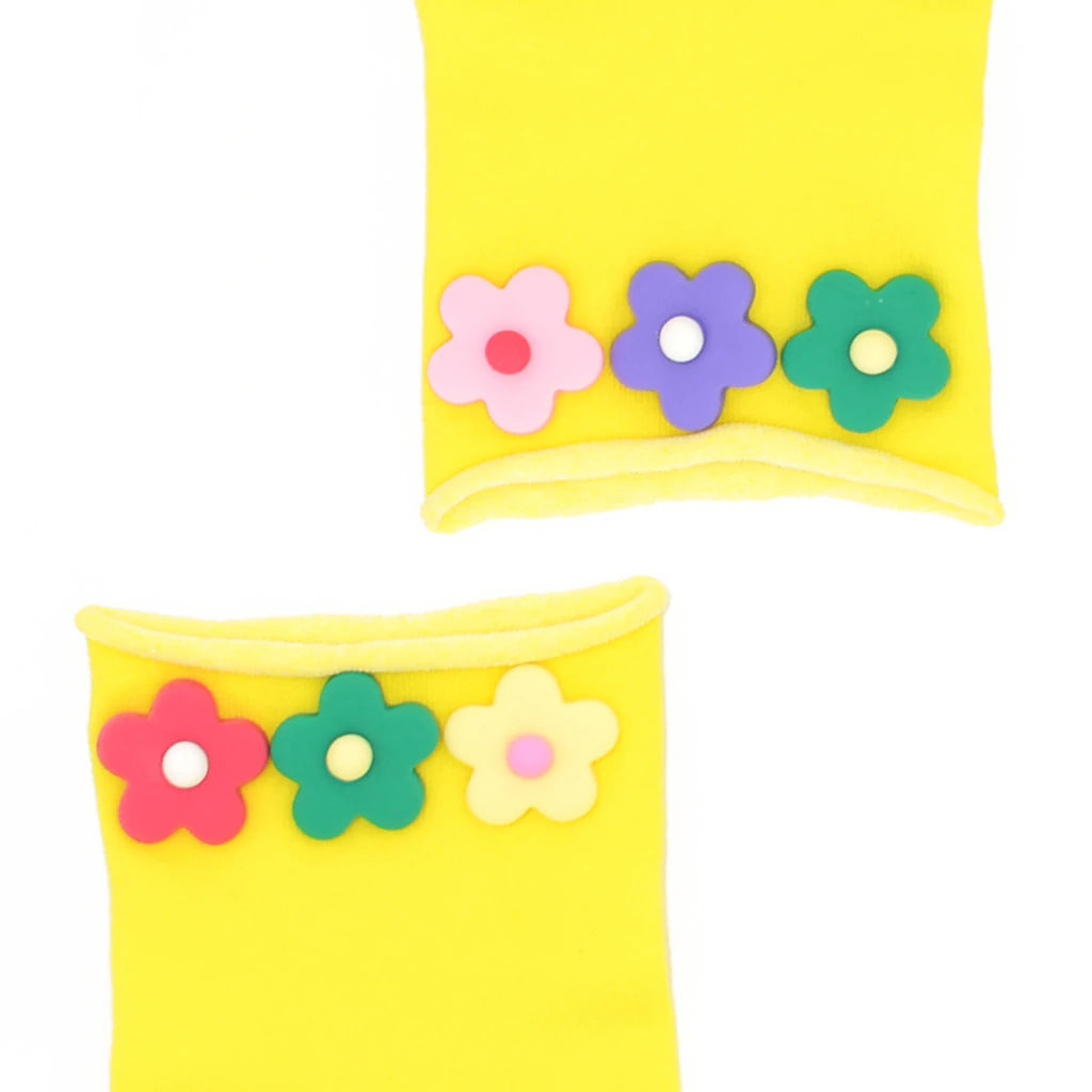 Yellow socks with colorful flower designs on a white background