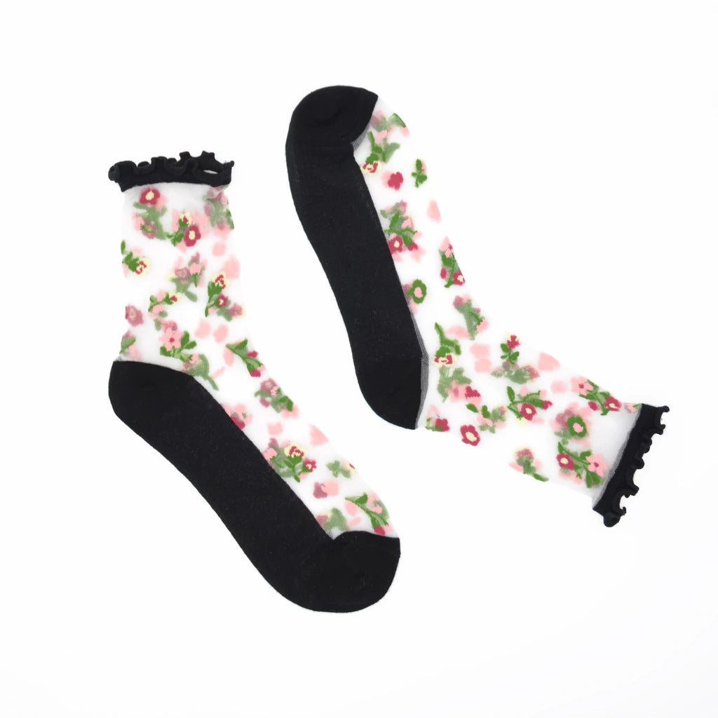 Floral patterned socks with black ruffles on a white background