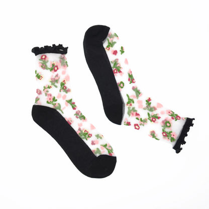 Floral patterned socks with black ruffles on a white background