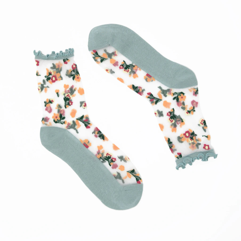 Floral-patterned socks with green accents on a white background