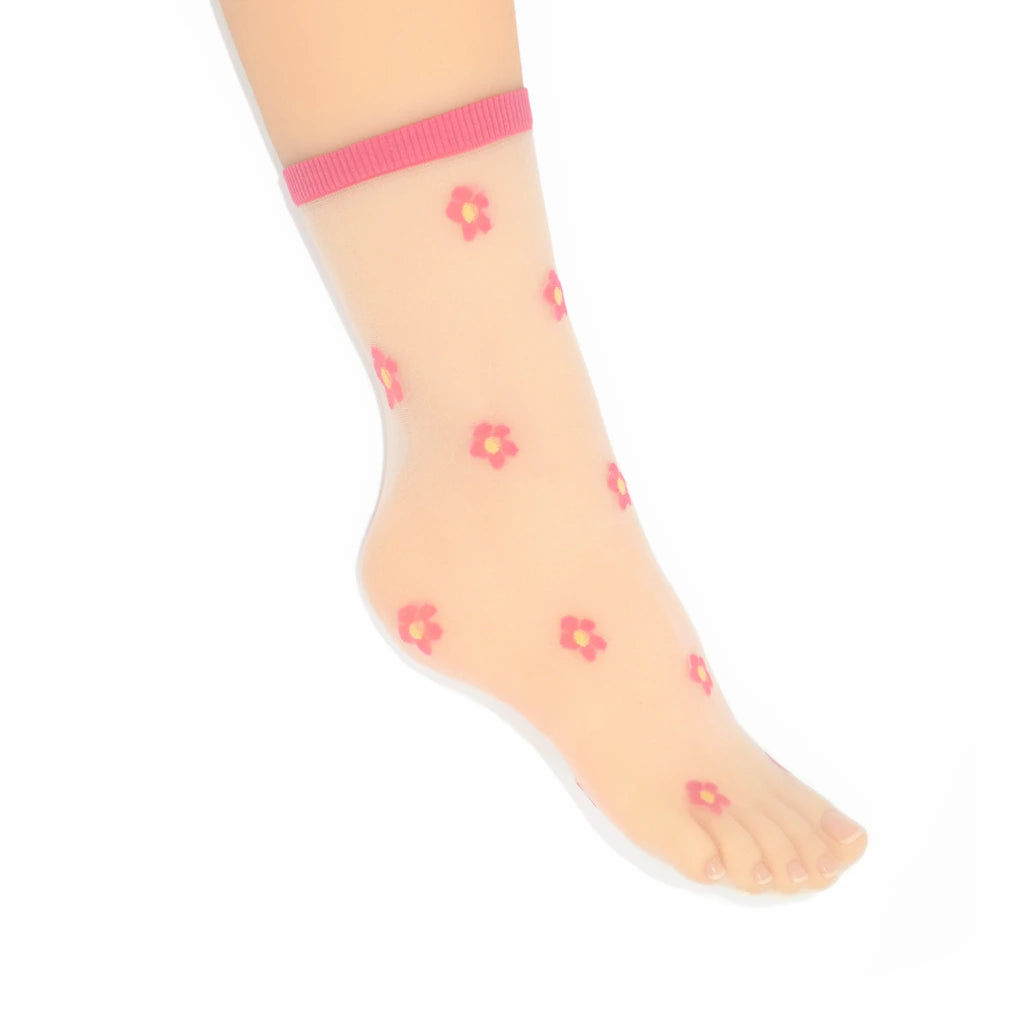 A leg modelling the Isla sheer daisy ankle socks in fuchsia pink on cream mesh base