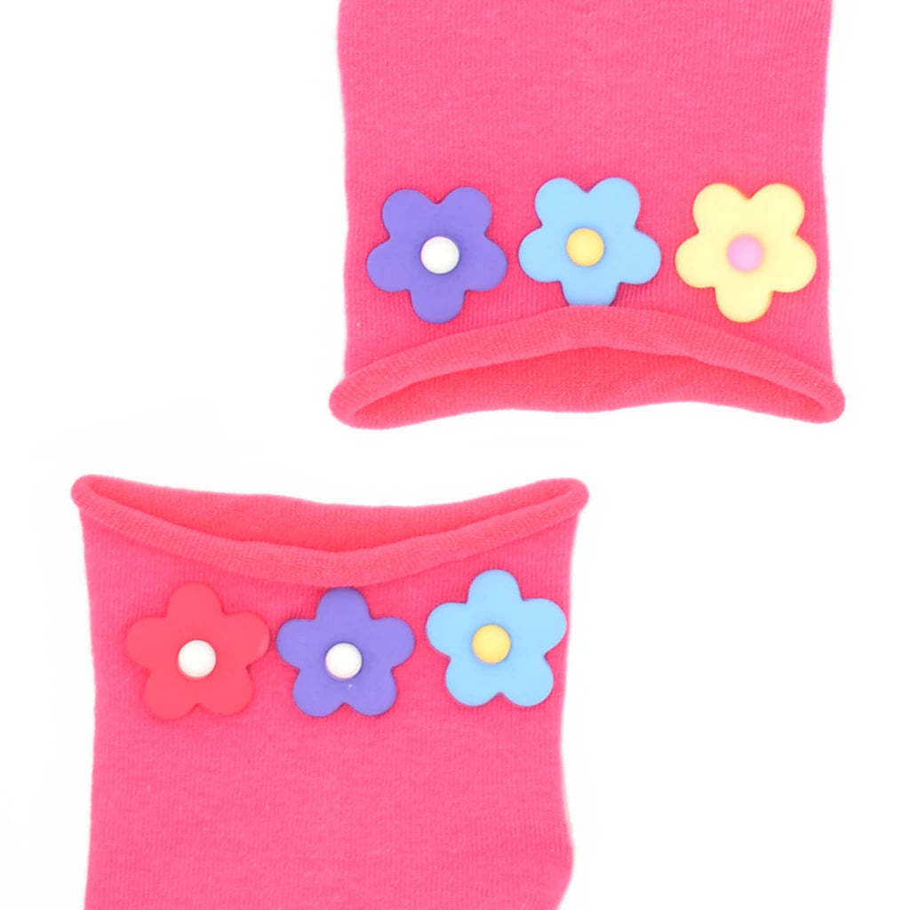 Pink socks with colorful flower designs on a white background