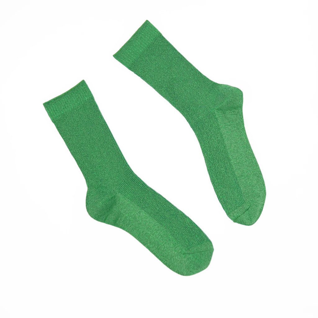Pair of green socks on a white background