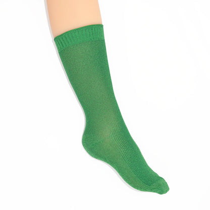 Green crew sock against a white background