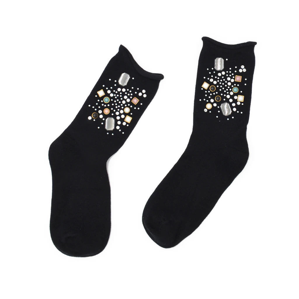 Black socks with decorative elements on a white background