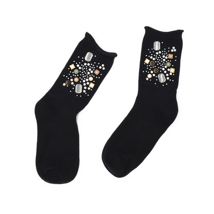 Black socks with decorative elements on a white background