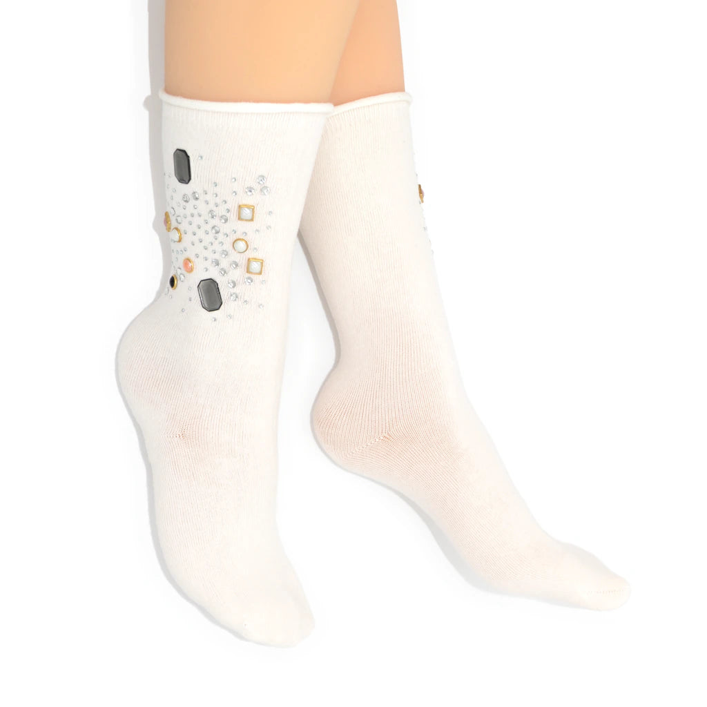 White ankle sock with gray and orange pattern on a white background