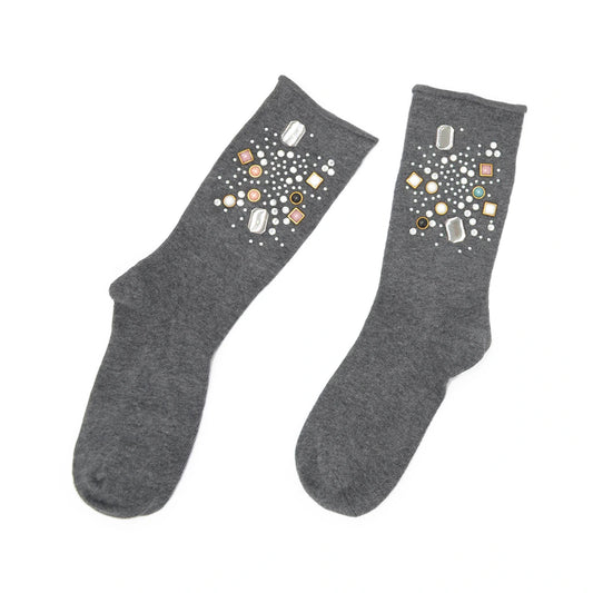 Pair of gray socks with decorative stones on a white background