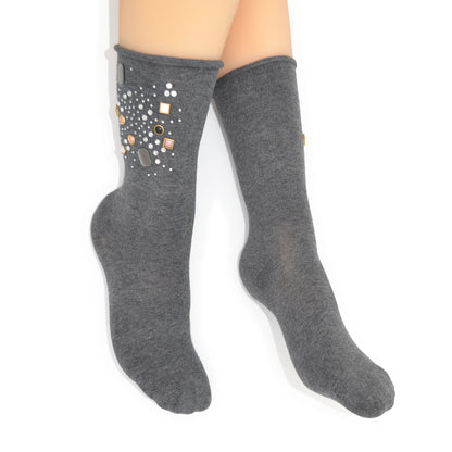 Gray knee-high socks with decorative elements on a white background