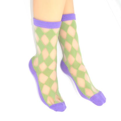 Green and purple patterned socks on a white background