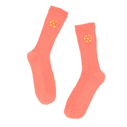 Coral socks with an embroidered grapefruit motif on a white background