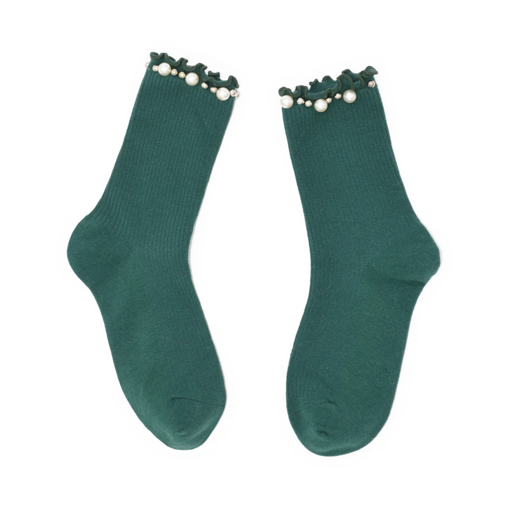 Pair of green socks with pearl details on a white background