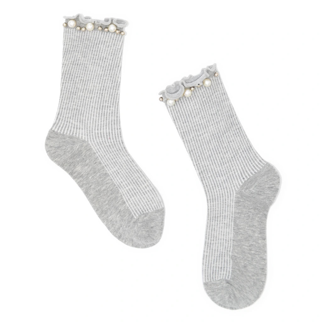 Pair of gray socks with pearl embellishment on a white background