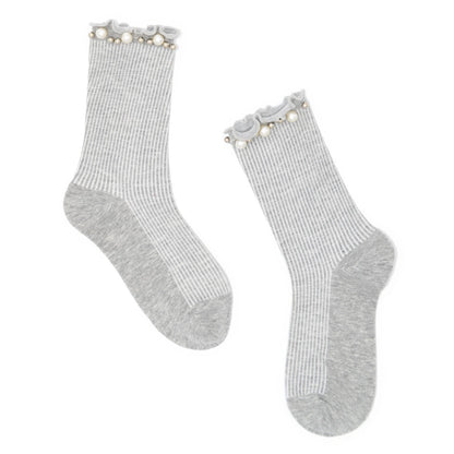 Pair of gray socks with pearl embellishment on a white background