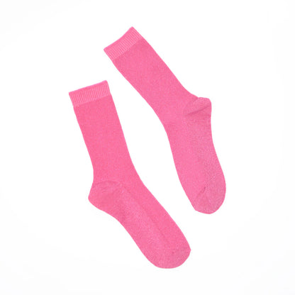 Pair of bright pink socks on a white background