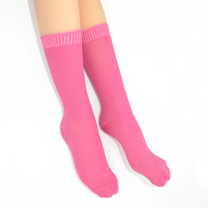 Pink crew socks on a white background