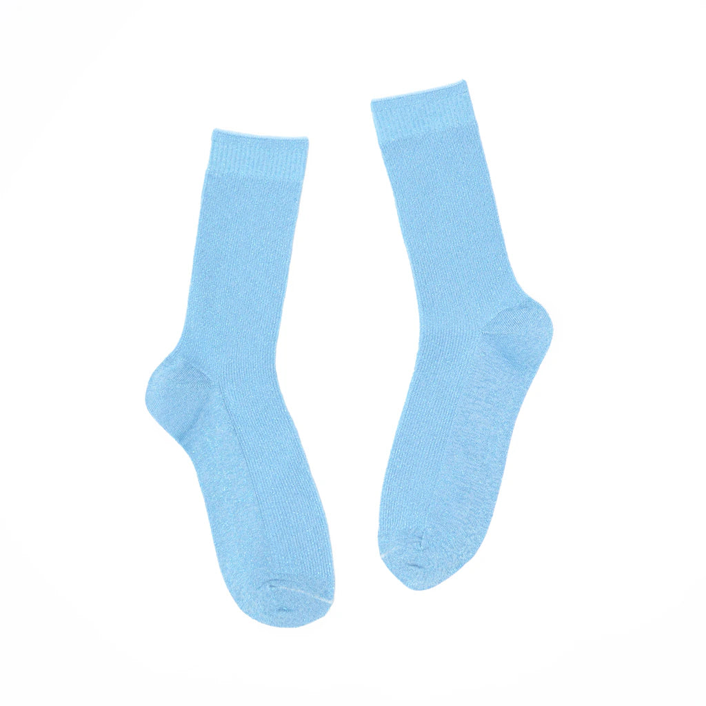 Pair of light blue socks on a white background
