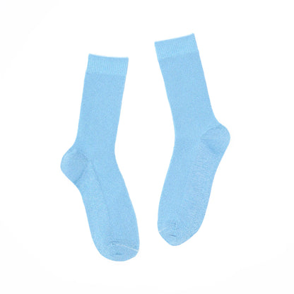 Pair of light blue socks on a white background