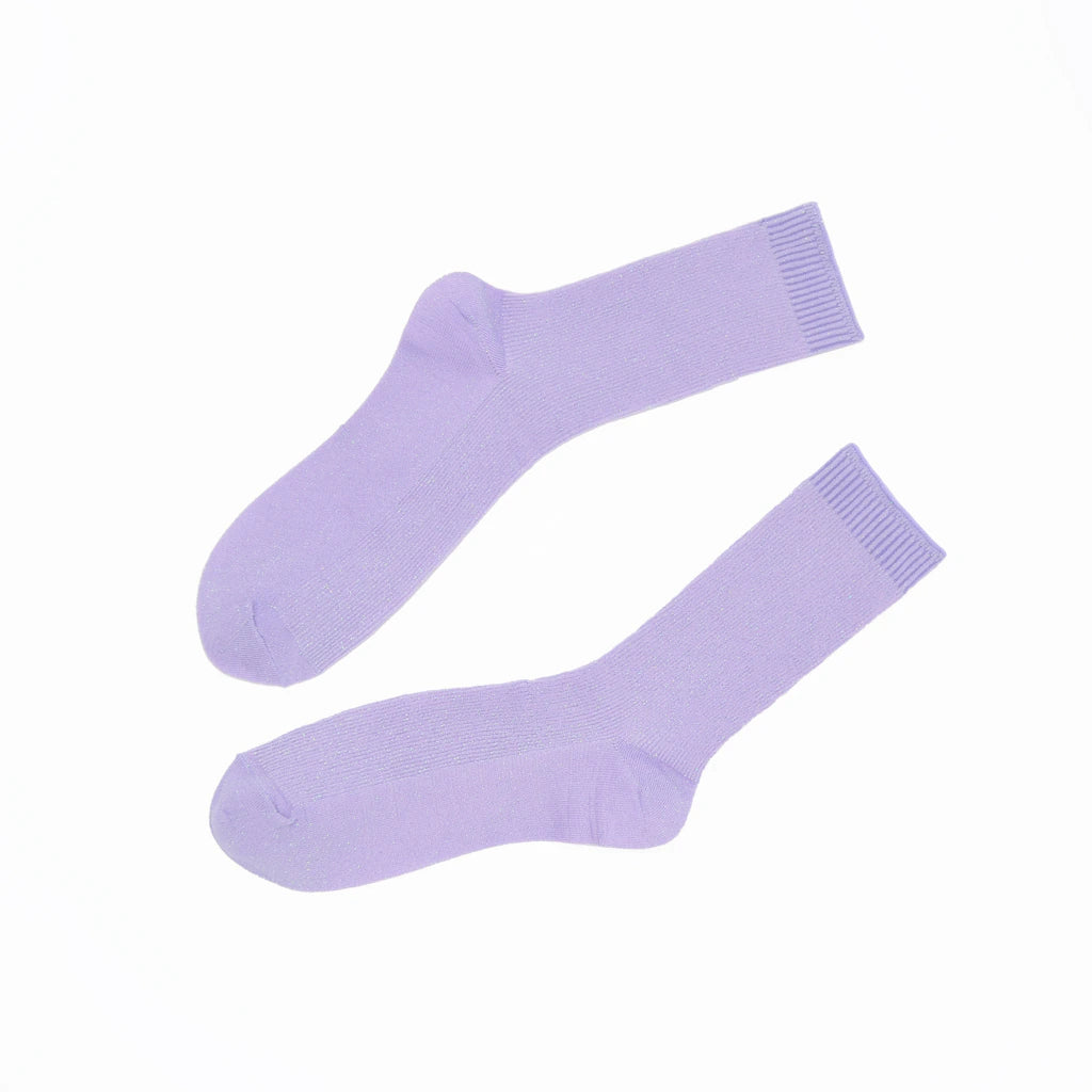 Pair of light purple socks on a white background