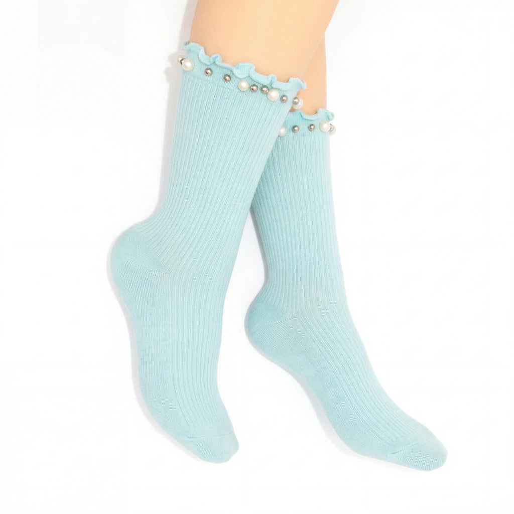 Light blue socks with pearl details on a white background