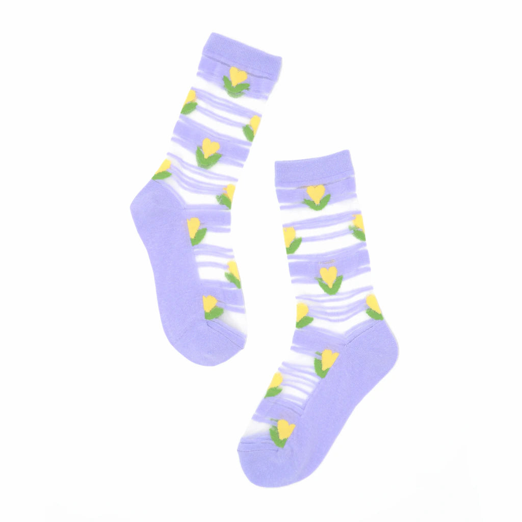 Pair of light purple socks with yellow tulip patterns on a white background
