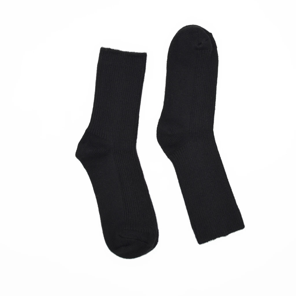 A pair of black socks displayed flat against a solid white background.