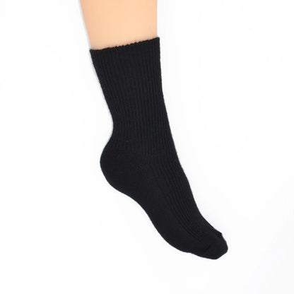 A single black ribbed crew sock shown on a foot against a plain white background.