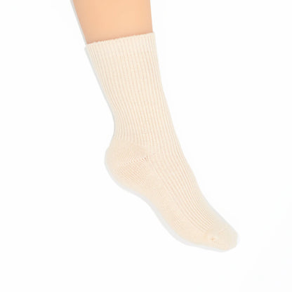 A single ribbed ankle sock in a warm off-white or cream color, shown on a   foot against a plain white background.