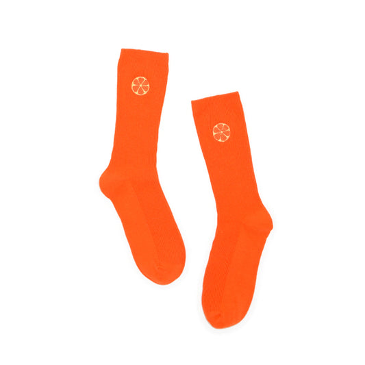 Orange socks with an embroidered orange on a white background