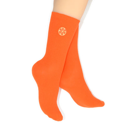 Orange socks with an embroidered orange on a white background