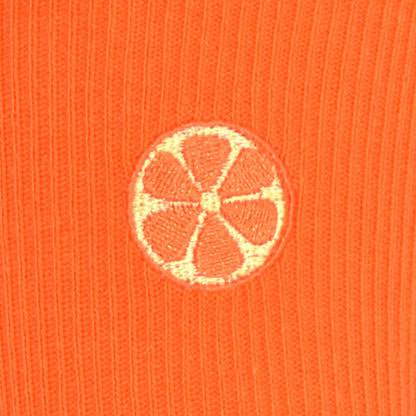 Embroidered orange on a ribbed knit orange fabric background
