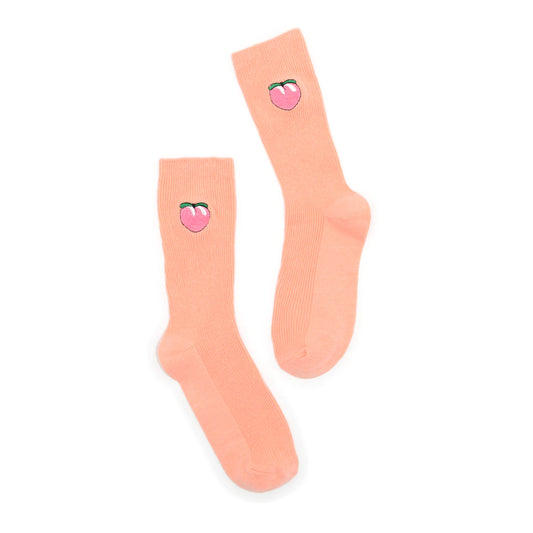 Pair of peach-colored socks with peach design on a white background