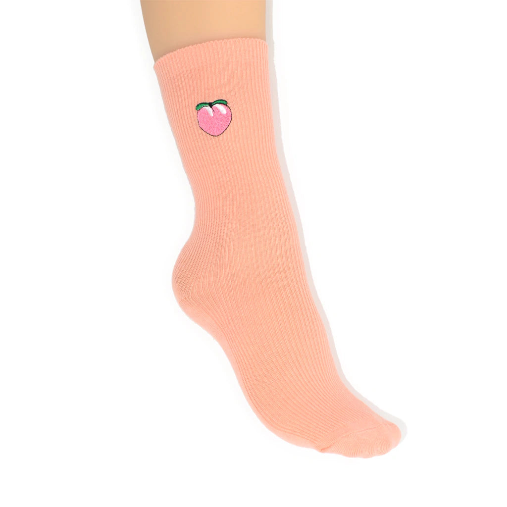 Pink sock with a peach design on a white background