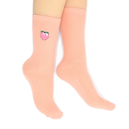 Pink sock with a peach design on a white background