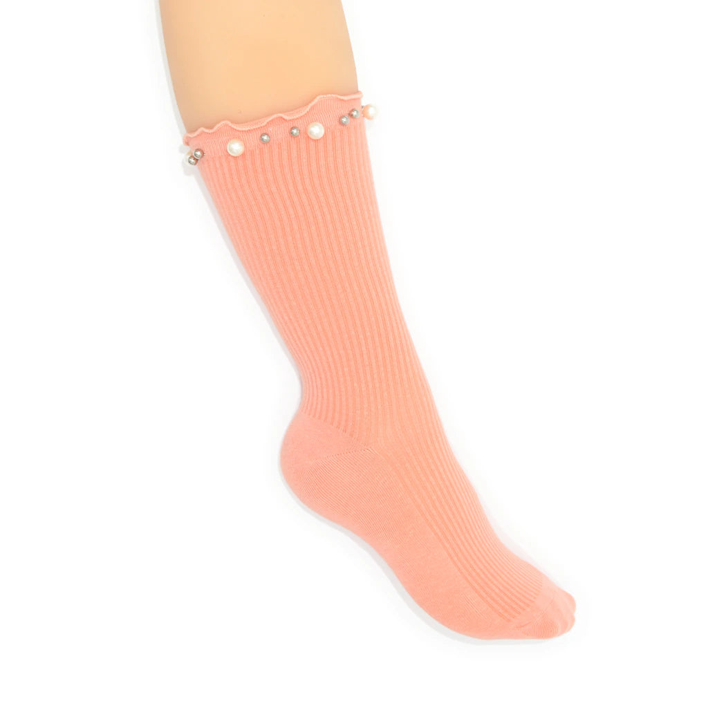 Peach-colored sock with embellished pearls on a white background
