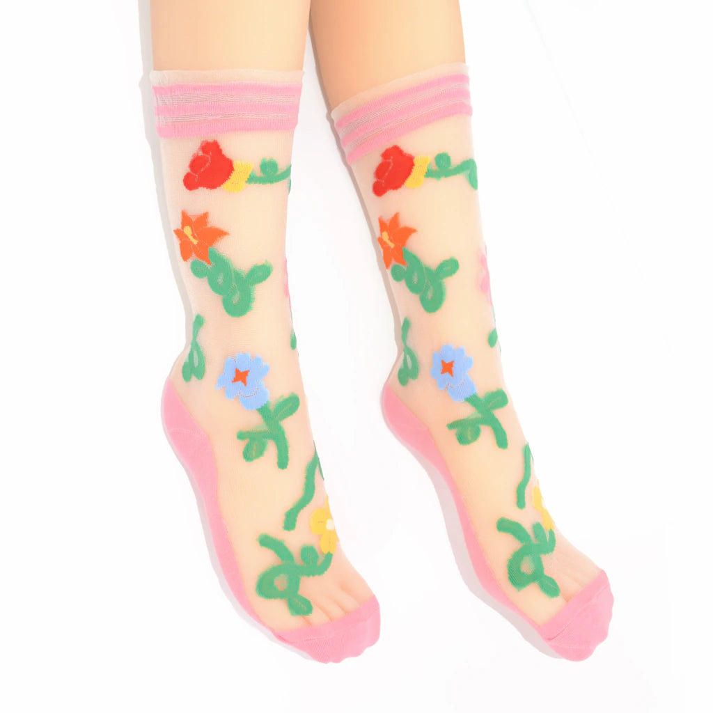Colorful floral-patterned socks with pink accents on a white background