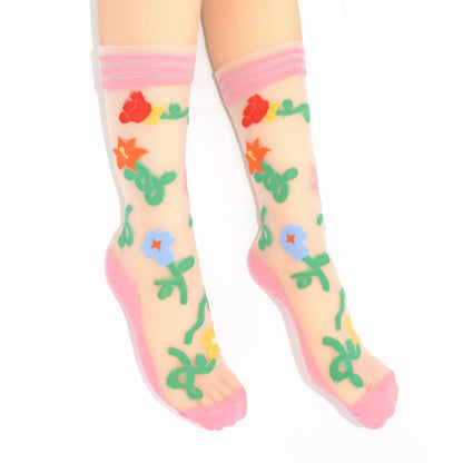Colorful floral-patterned socks with pink accents on a white background