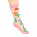 Colorful socks with floral patterns on a white background