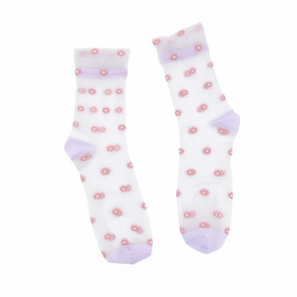 A pair of white sheer mesh crew socks decorated with small pink flower motifs and light purple cuffs, heels, and toes, displayed against a solid white background.