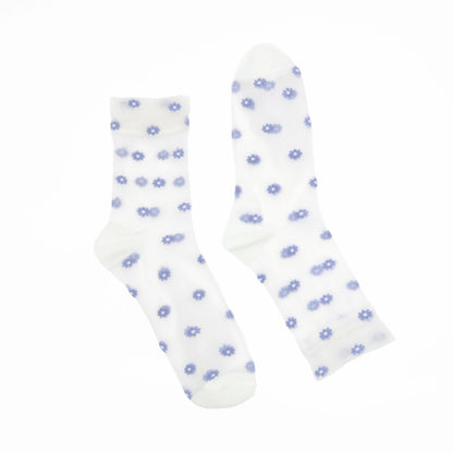 A pair of white crew socks with a small blue daisy pattern, displayed against a solid white background.