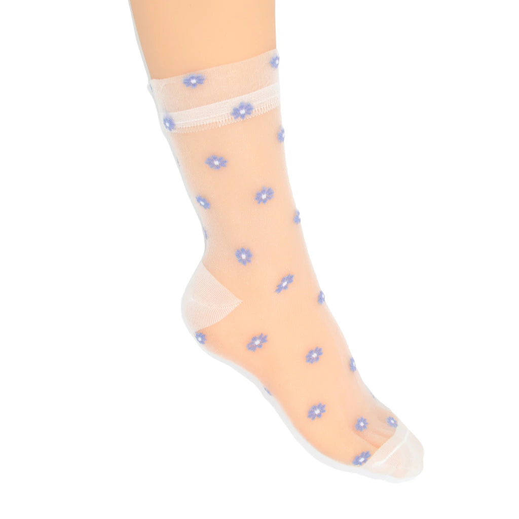 A single sheer white ankle sock with small blue and white floral patterns, shown on a model's foot against a plain white background.
