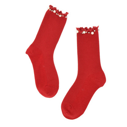Pair of red socks with embellished pearl top on a white background