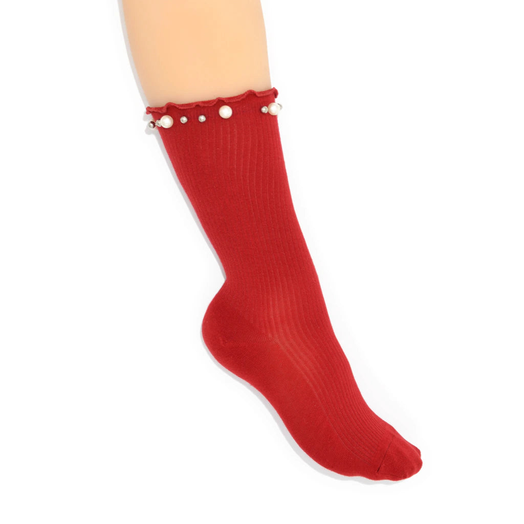Red sock with pearl embellishment details on a white background
