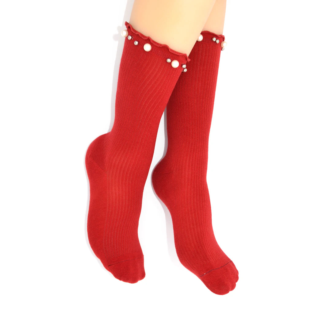 Red socks with pearl details on a white background
