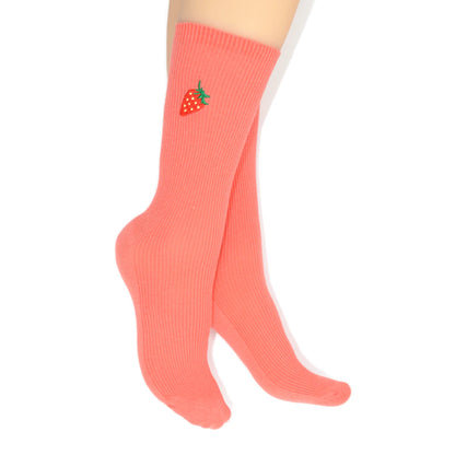 Coral socks with a strawberry design on a white background