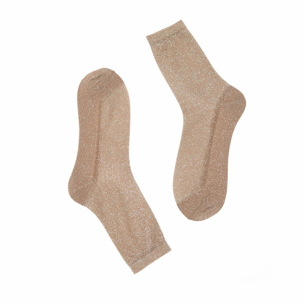 Pair of gold glitter socks on a white background