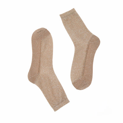 Pair of gold glitter socks on a white background